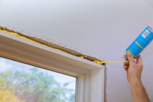 Man In A Using A Mounting Foam The Window And The 2023 11 27 05 04 16 Utc (1) Min